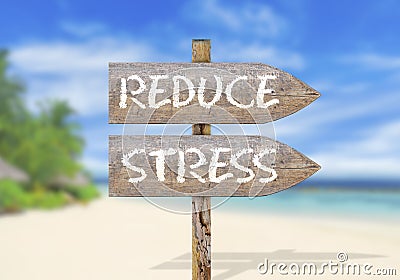 Wooden direction sign with reduce stress Stock Photo