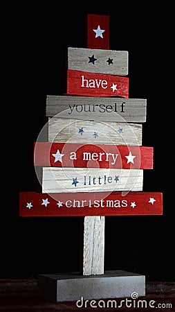 Wooden directional boards with Christmas saying written on them Stock Photo