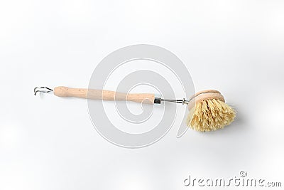 Wooden dish brush with bamboo wood and natural Bristle Tampico Fiber, on white background . Item for cleaning in kitchen Stock Photo