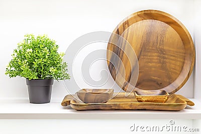 Wooden dishes. Kitchen utensils and accessories made of bamboo, interior details. Eco-friendly products. Various salad bowls, Stock Photo