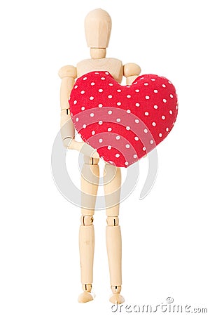 Wooden doll holds heart Stock Photo