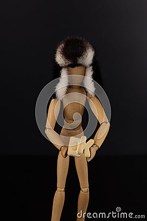 Wooden doll holds an ok sign. Stock Photo