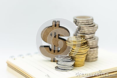 Wooden dollar sign and coins. Image use for sale, buy, trade, deal, business time concept Stock Photo