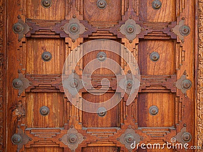 Wooden door on ancient facade wood gate vintage portal wall background Stock Photo