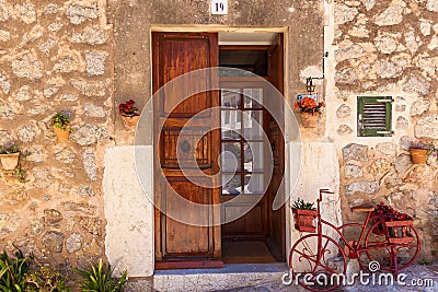 Wooden door with bicycle Editorial Stock Photo