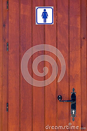 Wooden door of ladies toilet Stock Photo