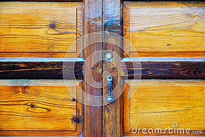 Wooden door with lock and knocker Stock Photo
