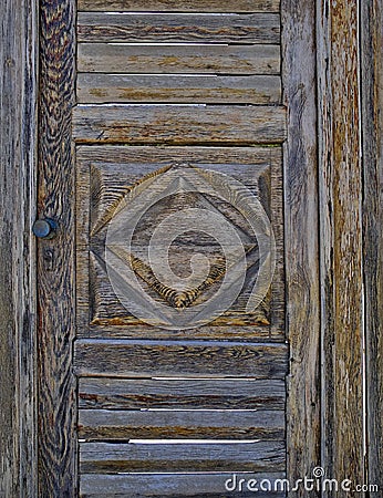 Wooden door with rhomb closeup Stock Photo