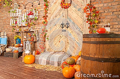 Wooden doors with autumn yellow leaves, pumpkins, autumn. Stock Photo