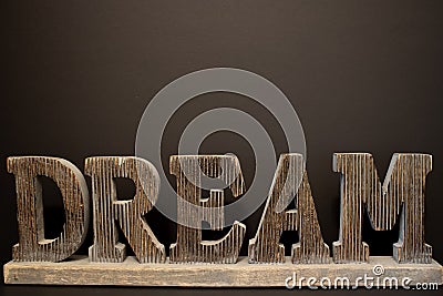 Wooden Dream large word on the black background. Stock Photo