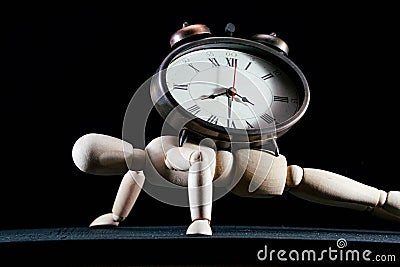 wooden dummy and analogic clock, time concept, puppet made of wood, art mennequin.Wooden Doll Stock Photo