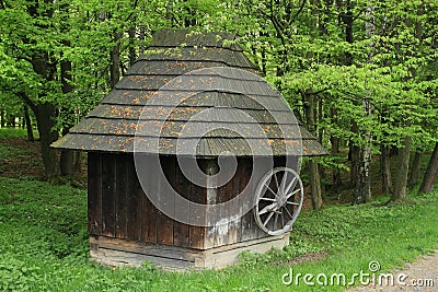 Covered wooden dwell by forest Stock Photo