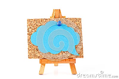 Wooden easel with corkboard and blue speech bubble Stock Photo
