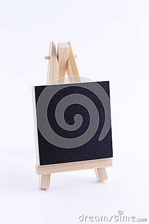 Wooden Easel Miniature with Blank Black Square Canvas for Artists and Painters Stock Photo