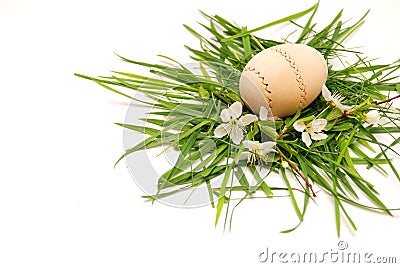 Wooden easter egg in a green grass nest Stock Photo