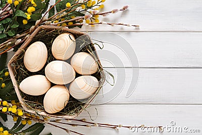 Wooden easter eggs on white wood background Stock Photo