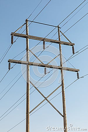 Wooden electic pole with a blue sky Stock Photo