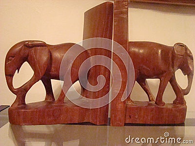 Wooden elephant bookends Stock Photo