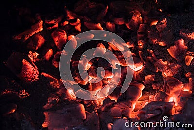 Wooden embers glowing pieces in stove Stock Photo