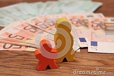 Wooden family with money Stock Photo