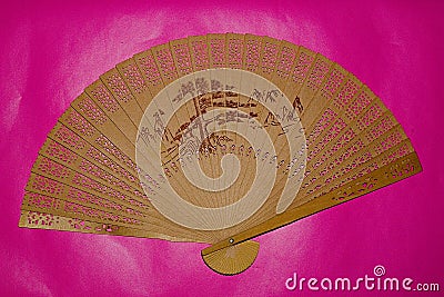 Wooden Fan On A Purple background Art Style Stock Photo