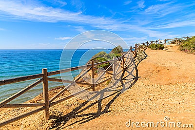 Wooden fence on cliff path Stock Photo