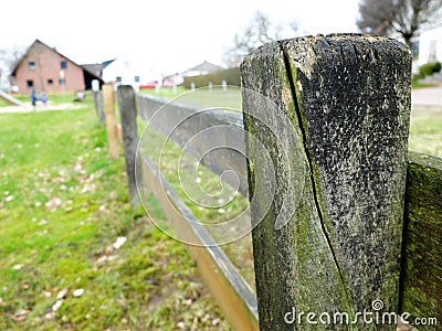 Wooden fence in a countryside. Close-up Stock Photo