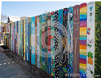 Wooden Fence with Individually Decorated Fence Boards at Ruth`s Roots in Bay St. Louis, Mississippi Editorial Stock Photo