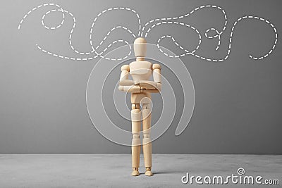 Wooden figure of businessman with thoughts about business Stock Photo