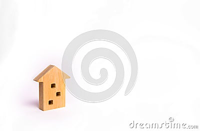 Wooden figure of a multi-storey house on a white background. Three-story house. Buying and selling of real estate, construction. A Stock Photo