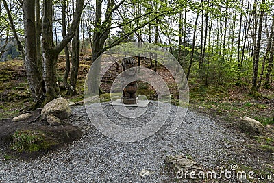 A wooden figure of a troll at the shore of Eivindsvannet lake in Djupadalen recreational and hiking area Editorial Stock Photo