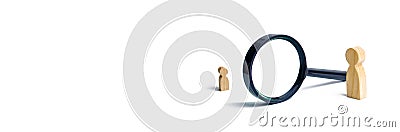 A wooden figure of a woman and a child stands near the magnifying glass. The concept of finding a child, the adoption of children Stock Photo