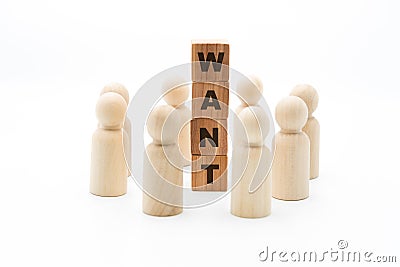 Wooden figures as business team in circle around word WANT Stock Photo