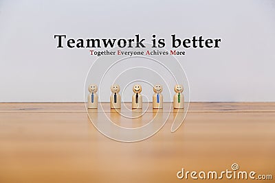 Wooden figures of a happy teamwork Stock Photo