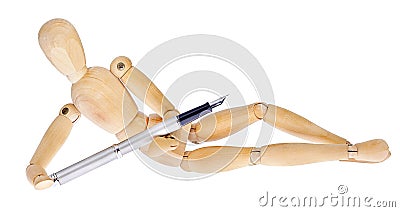 Wooden figures lying with fountain pen Stock Photo