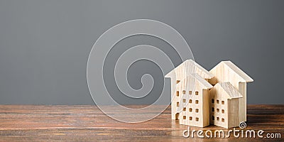 Wooden figures of residential buildings. Affordable comfortable housing. Purchase of apartments and real estate, rent and sale Stock Photo