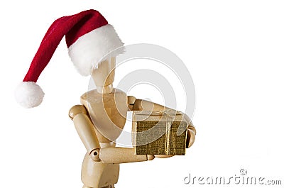 Wooden figurine holding holiday gift Stock Photo