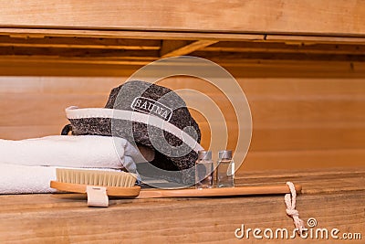 wooden Finnish sauna, shooting objects in the the empty steam room.traditional sauna accessories ,felt hat, towel Stock Photo