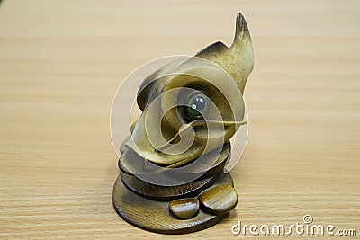 Wooden fish statuette Stock Photo