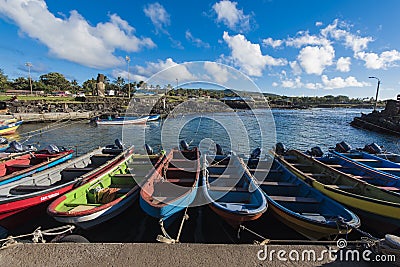 Wooden fishing boats in the natural port of Hanga Roa Editorial Stock Photo