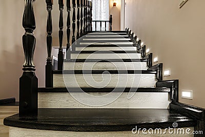 Wooden flight of stairs in a residential building Stock Photo