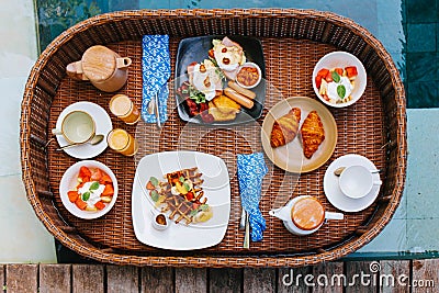 Wooden floating breakfast tray contains food and drink Stock Photo