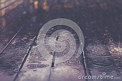 Wooden floor with rain drops, fall background Stock Photo