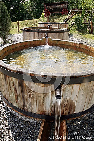 Wooden, flowing water tanks. Stock Photo