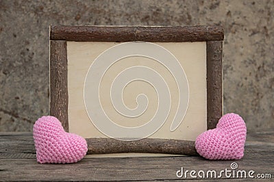 Wooden frame with heart on the wooden table Stock Photo