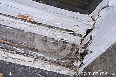 Wooden frame of an old window with peeling paint and rotten wood Stock Photo