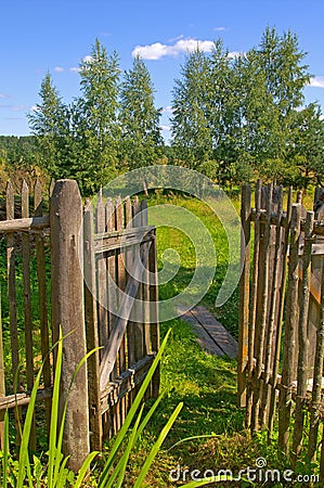 Wooden gate to the garden Stock Photo