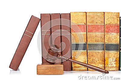 Wooden gavel and old law books Stock Photo