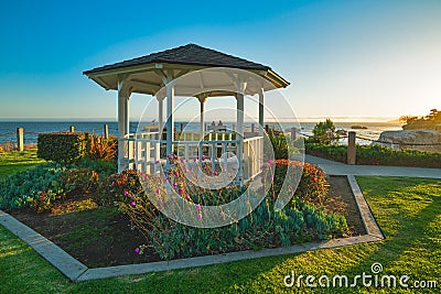 Wooden gazebo on a seashore at sunset, beautiful California Stock Photo