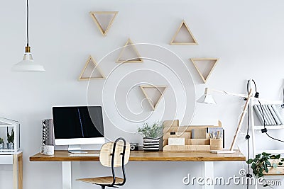 Wooden geometric frames on wall Stock Photo